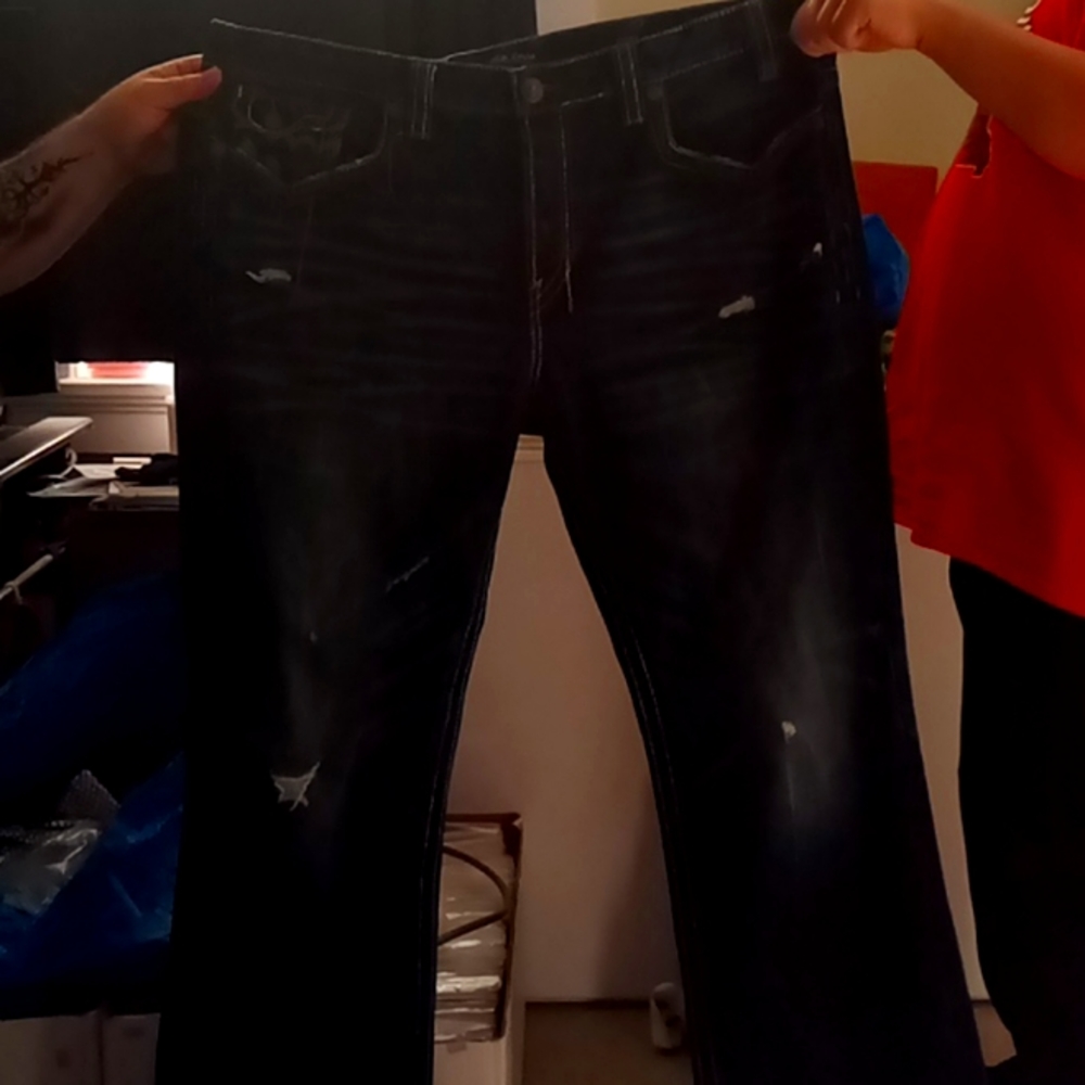 Mek street ware torn in jeans